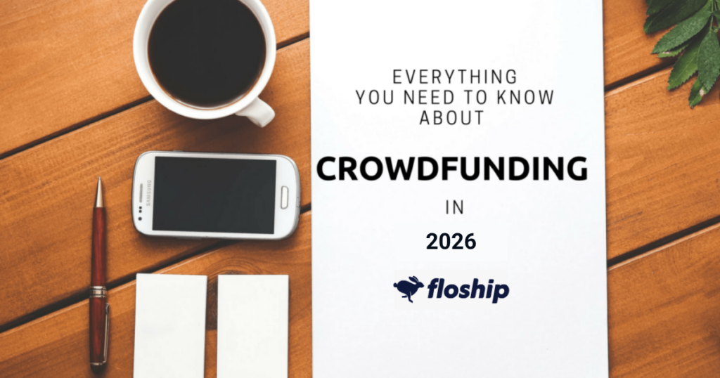 Desk scene with coffee, smartphone, pen, and two white cards beside a document titled 'Everything you need to know about Crowdfunding in 2026' (Floship).